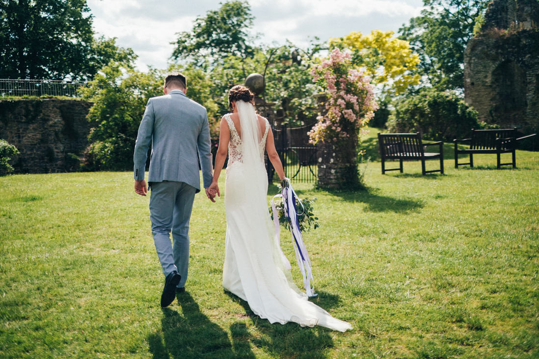 004 CANDID PORTRAIT OF BRIDE AND GROOM WALKING IN BEAUTIFUL DRESS USK CASTLE WEDDING PHOTOGRAPHY 004 CANDID PORTRAIT OF BRIDE AND GROOM WALKING IN BEAUTIFUL DRESS USK CASTLE WEDDING PHOTOGRAPHY